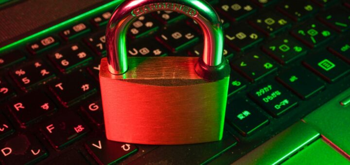 red padlock on black computer keyboard